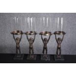 Four outside candleholders. Monkeys supporting glass covers. H.42cm.(each)