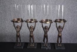 Four outside candleholders. Monkeys supporting glass covers. H.42cm.(each)
