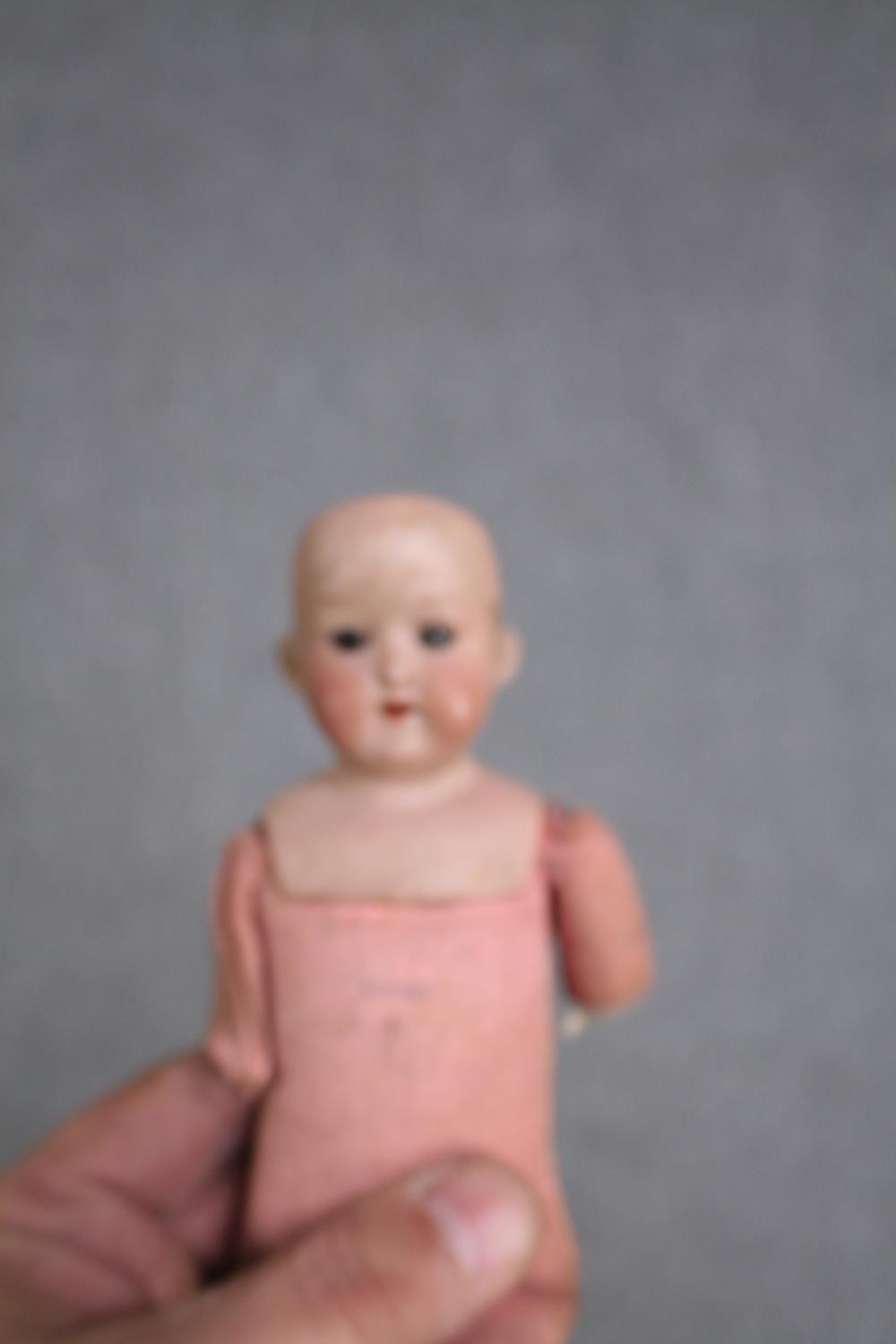 A collection of three dolls. With glass eyes. Two incomplete and missing arms. L.37cm. (largest) - Image 8 of 13