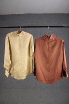 Two bespoke made silk shirts, one salmon and one gold with mother of pearl buttons, (to fit chest