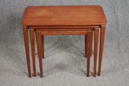 A nest of three graduating occasional tables. mid century teak. H.50 W.65 D.38cm. (largest)