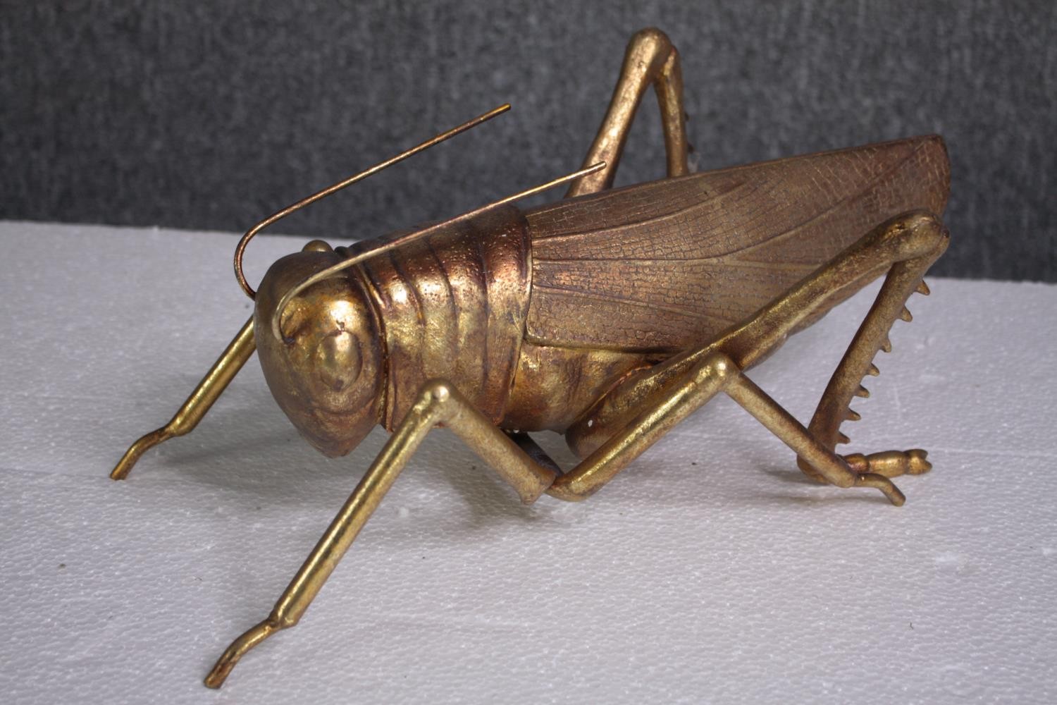 A decorative grasshopper, gold lacquered. H.5 W.39cm. - Image 2 of 5