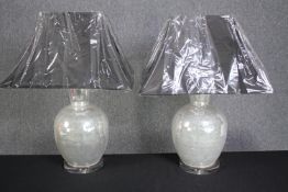 A pair of contemporary glass table lamps of baluster form. H.66cm. (New and unused).