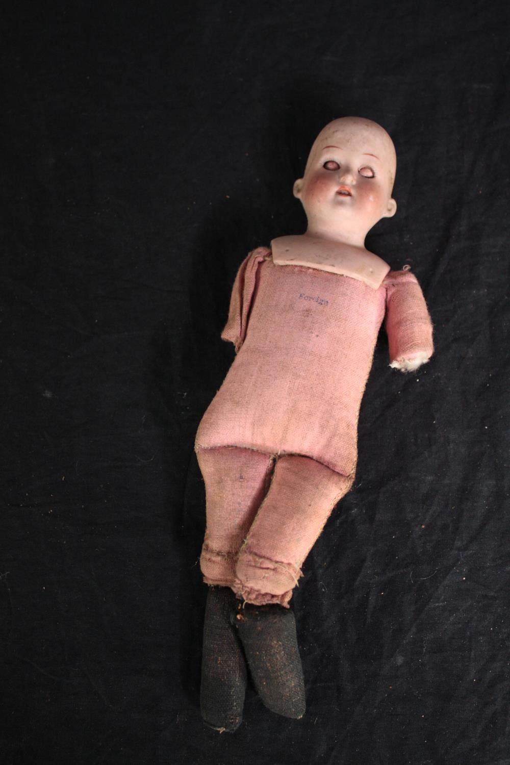 A collection of three dolls. With glass eyes. Two incomplete and missing arms. L.37cm. (largest) - Image 10 of 13