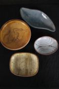 Studio pottery. Three glazed bowls. One decorated with a swan and signed 'R' on the base. L.29 W.