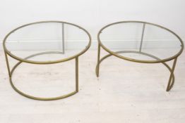 A pair of contemporary brass and glass coffee or lamp tables. H.36 W.70cm.