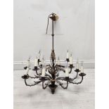 A contemporary metal twelve branch chandelier of naturalistic form. H.57 W.62 D.62cm.