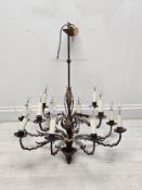 A contemporary metal twelve branch chandelier of naturalistic form. H.57 W.62 D.62cm.
