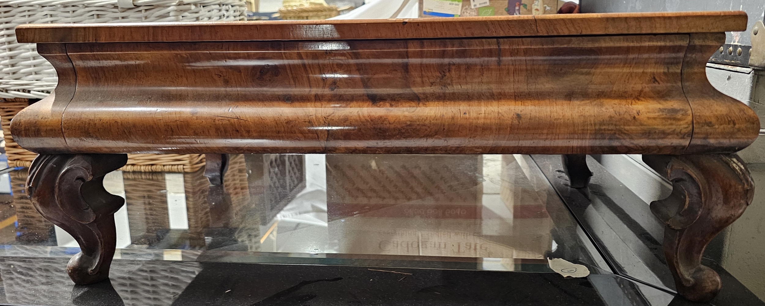 A Victorian figured walnut low table fitted with a drawer. H.26 W.63 D.43cm.