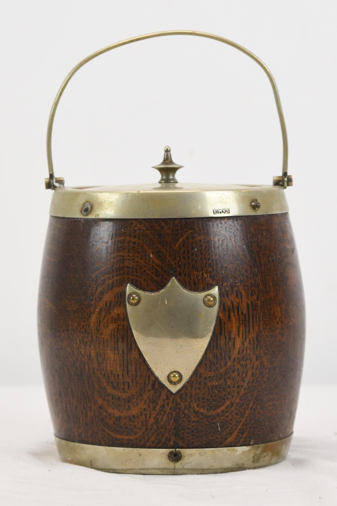 A wooden and silver plated ice bucket.