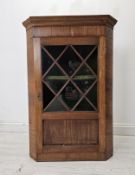 Hanging corner cabinet, 19th century mahogany astragal glazed with two panels missing. H.100 W.70