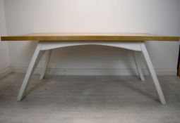A contemporary oak topped dining table on painted base. H.79 W.200 D.100cm.
