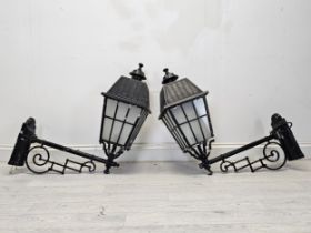 A pair of Victorian style metal wall mounted street lanterns. H.80 W.72 D.28cm (each)