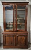 A 19th century style mahogany library bookcase, in two sections. H.223 W.130 D.60cm.