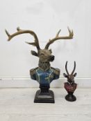 A polychrome moulded bust of a stag in uniform along with a smaller example. Largest is H.60 W.60
