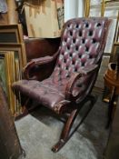 A vintage leather upholstered armchair. H.95 W.58 D.80cm. (One arm needs fixing).