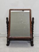 A 19th century mahogany swing toilet mirror.