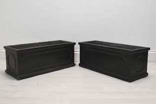 A pair of 19th century style faux lead planters, modern in fibreclay. H.26 W.58 D.23cm.