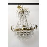 A basket chandelier with gilt metal frame and crystal swags and drops. H.90 W.55cm.