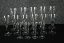 A set of fifteen conical glasses in three sizes. H.22cm. (largest)