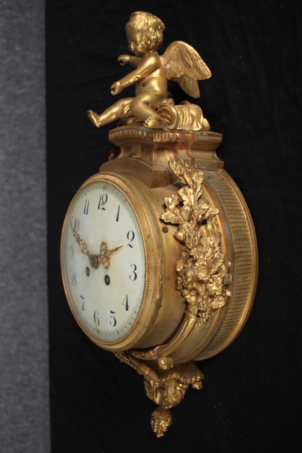 A Rococo cartel style gilt metal clock mounted with a cherub. H.46 W.27cm. - Image 3 of 7