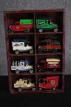 Oxford Diecast. A collection of eight 'vintage model' cars. In a wooden display case. H.31 W.