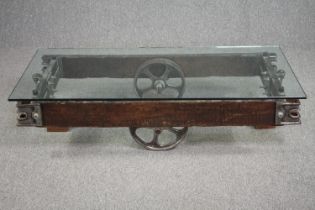 A vintage coffee table in the form of a railway tender made from reclaimed parts. H.33 W.139 D.65cm.