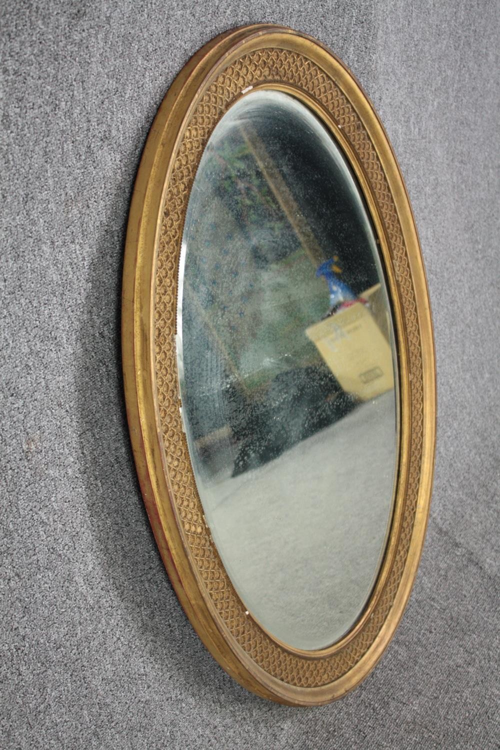 A C.1900 gilt framed mirror with bevelled plate. H.96 W.66cm. - Image 3 of 4