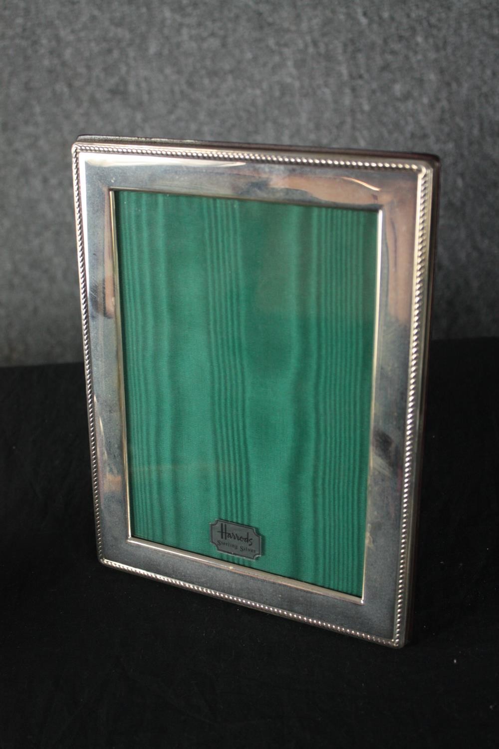 A Harrods sterling silver photo frame, a silver handled magnifying glass and collection of miniature - Image 2 of 5