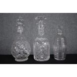 Three cut glass decanters. Various styles. H.26cm. (largest)