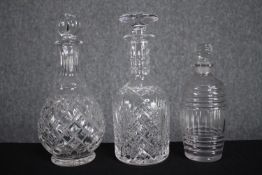 Three cut glass decanters. Various styles. H.26cm. (largest)