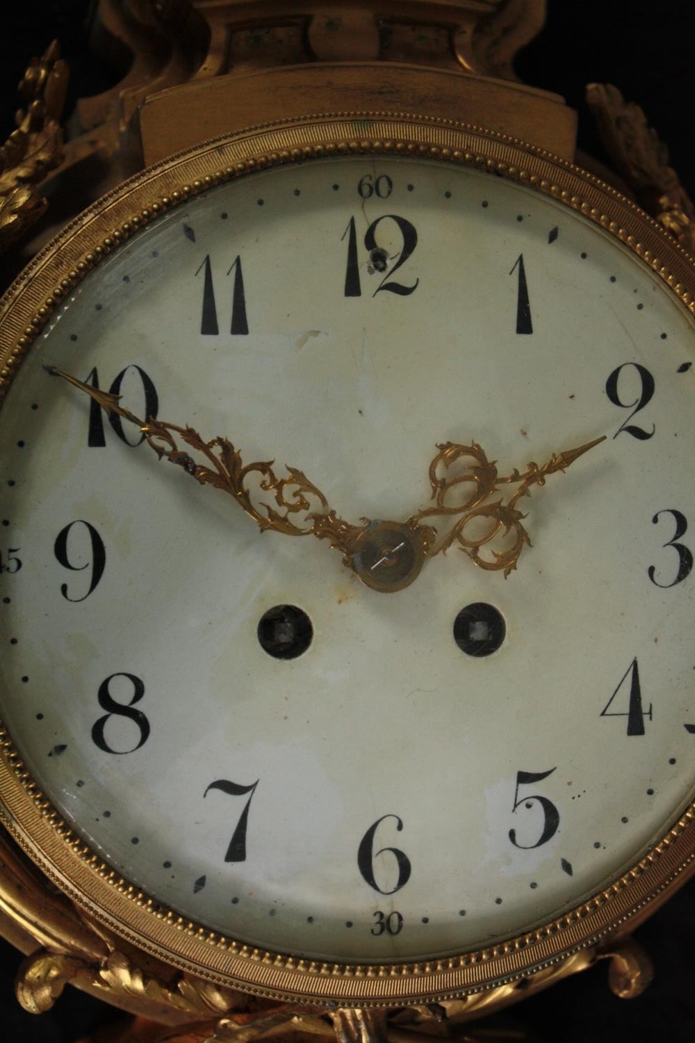 A Rococo cartel style gilt metal clock mounted with a cherub. H.46 W.27cm. - Image 4 of 7