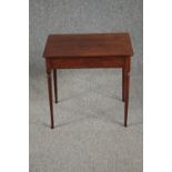 A 19th century mahogany lamp table on slender turned tapering supports. H.50 W.54 D.38cm.