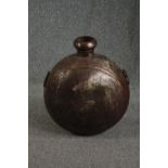 A brass flask. Probably late nineteenth century. H.61 W.52cm.