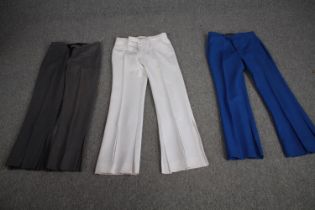 Three pairs of bespoke made vintage flared trousers in various colours, (to fit waist 32'' approx).