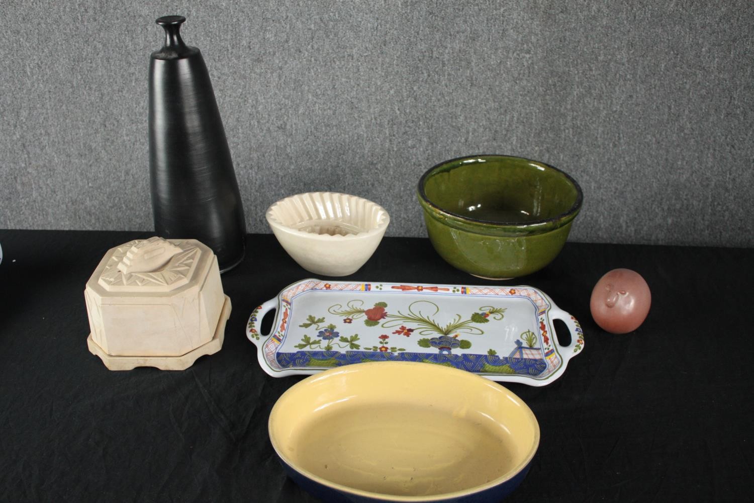 A mixed collection of porcelain kitchenware and a vase. Including a butter cooler, dish and a