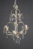 A floral chandelier with three branches of lights and decorated with teardrop glass. H.40cm.