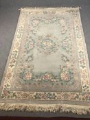 Carpet, Chinese woollen with allover flowerhead and foliate decoration. L.286 W.186cm.