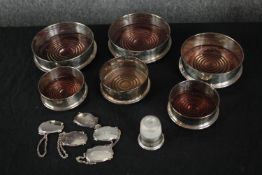 A collection of silver plate, including a set of six drinks labels, six oak and silver plate wine