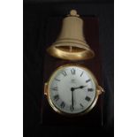 A brass cased Schatz clock with a bell mounted above. Ocean Quartz. H.42 W.22cm.