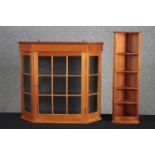 A contemporary pine wall cabinet along with a similar CD rack and corner cupboard. H.69 W.74 D.18cm.