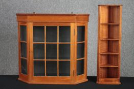 A contemporary pine wall cabinet along with a similar CD rack and corner cupboard. H.69 W.74 D.18cm.