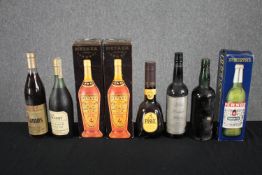 A mixed collection of eight vintage bottles of spirits including Metaxa, Pernod and Samos.
