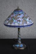 A large Tiffany style desk lamp with leaded glass shade and base. Decorated with dragonflies. H.