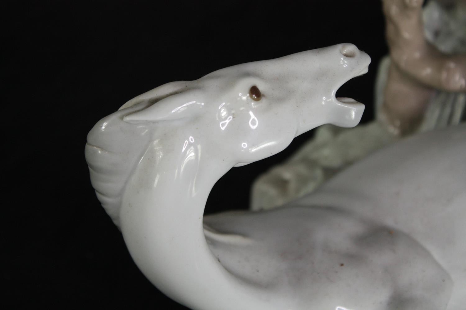 A large Lladro figure group of two white horses. Modelled on a rocky landscape. Along with a metal - Image 9 of 9