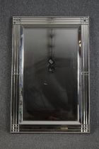 Wall mirror, contemporary with bevelled plate in glazed frame. H.120 W.80cm.