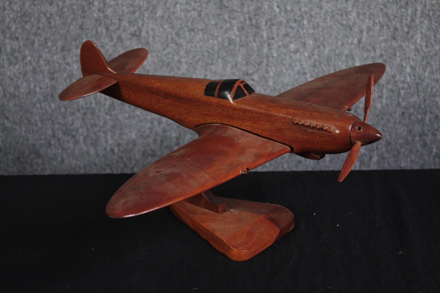 A large carved Supermarine Spitfire. Desk model. Missing one blade to its propeller and one - Image 2 of 4