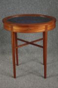 An Edwardian satinwood bijouterie display table with hinged glazed top on ebony strung tapering
