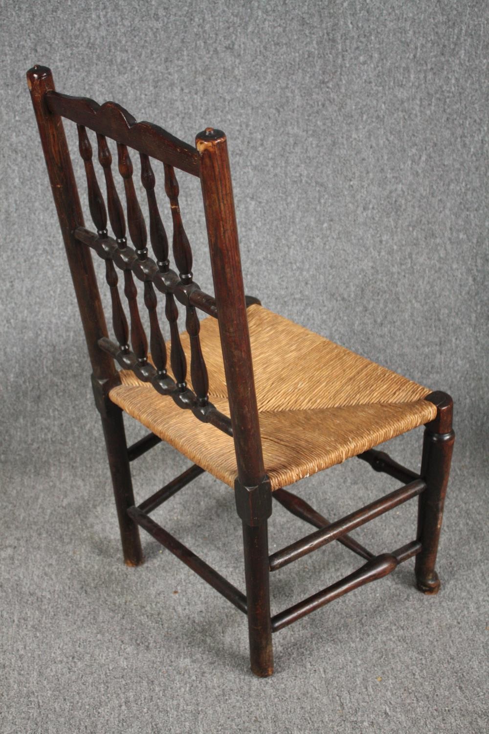 Dining chairs, a pair of early 19th century Lancashire style spindle back in elm and oak. - Image 4 of 6