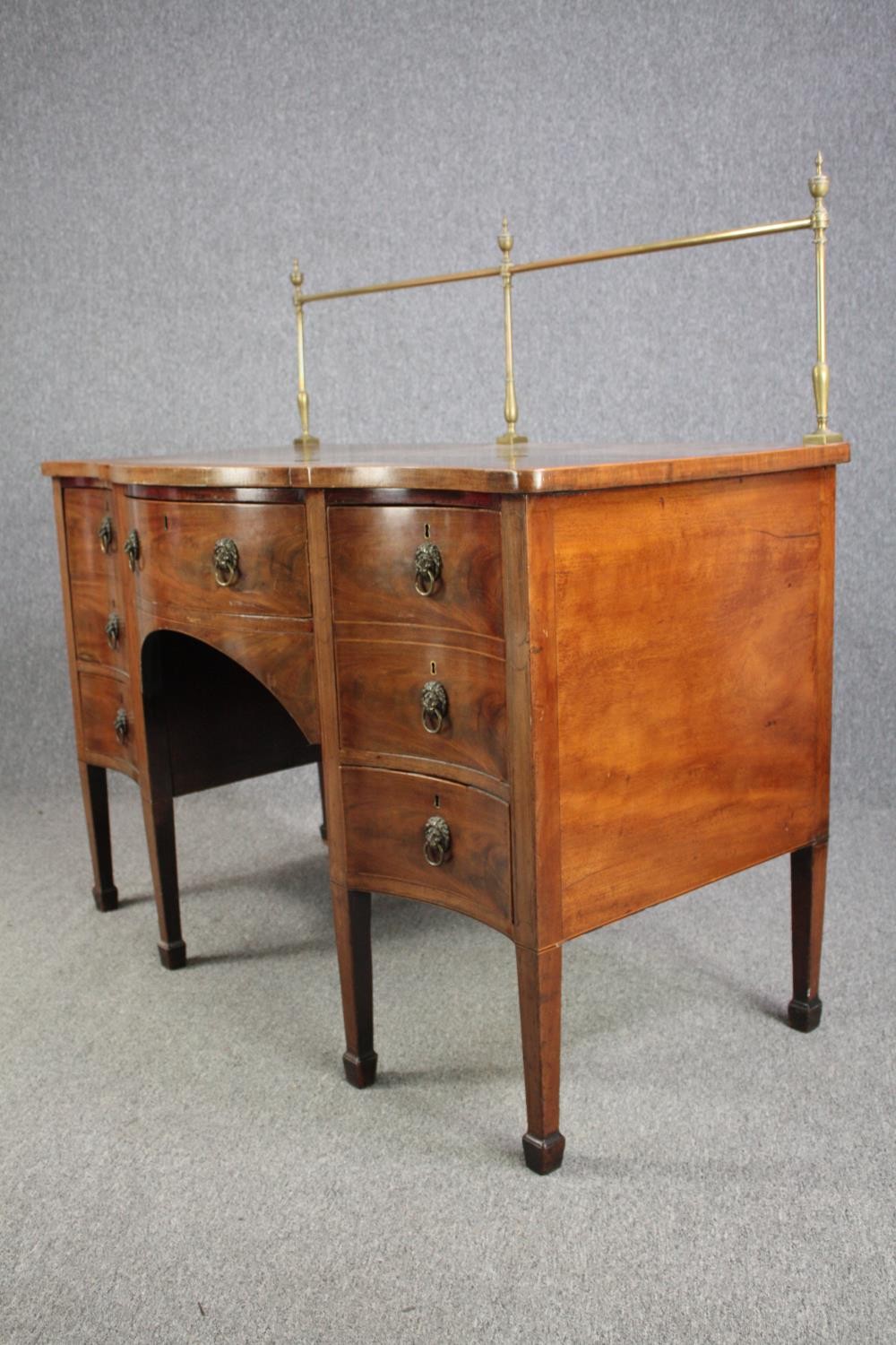 Sideboard, late Georgian mahogany serpentine fronted with brass rail. H.129 W.136 D.73cm. - Image 4 of 7